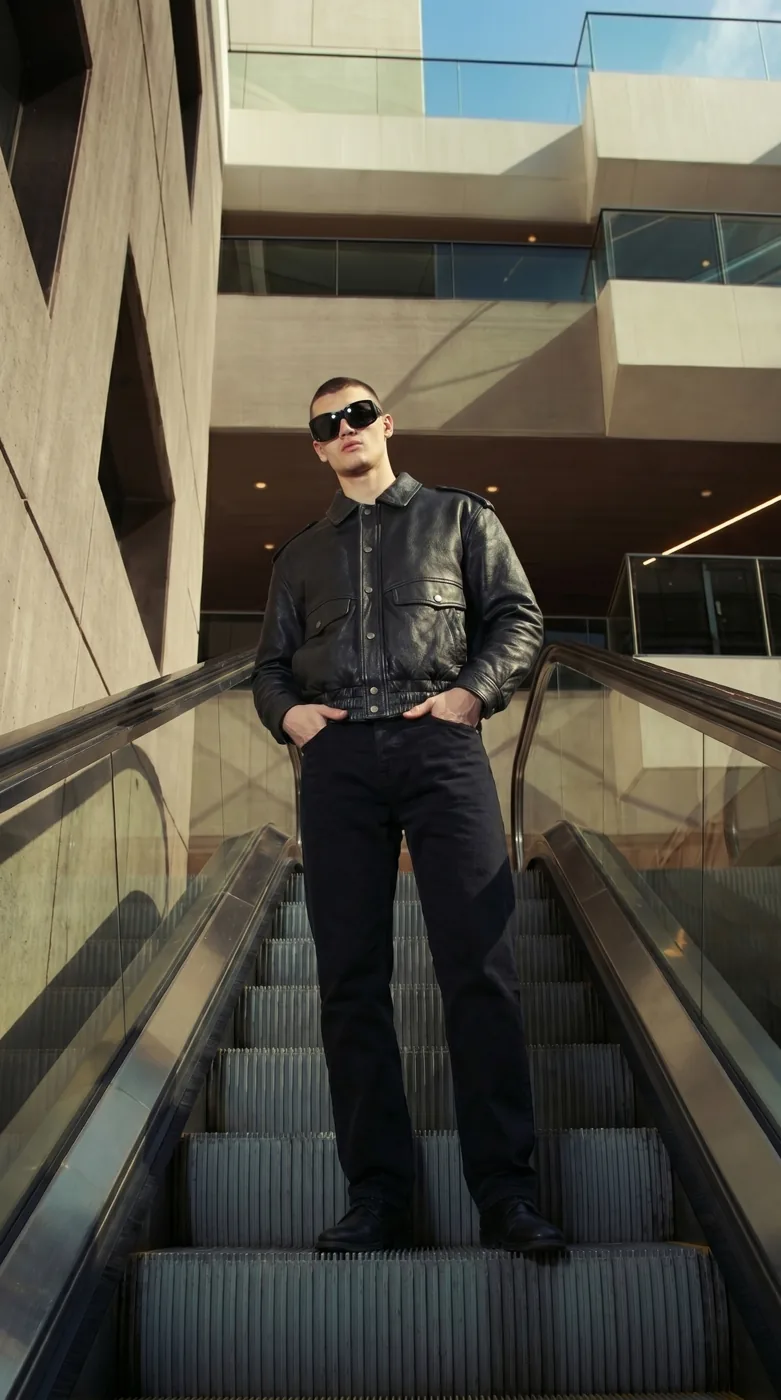 Man wearing Buneri black leather bomber jacket