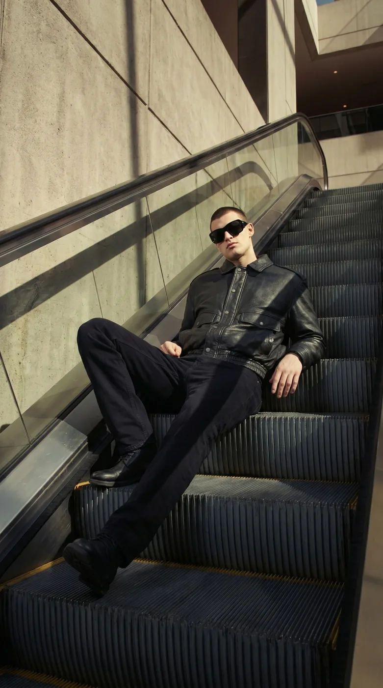 Man wearing Buneri black leather bomber jacket